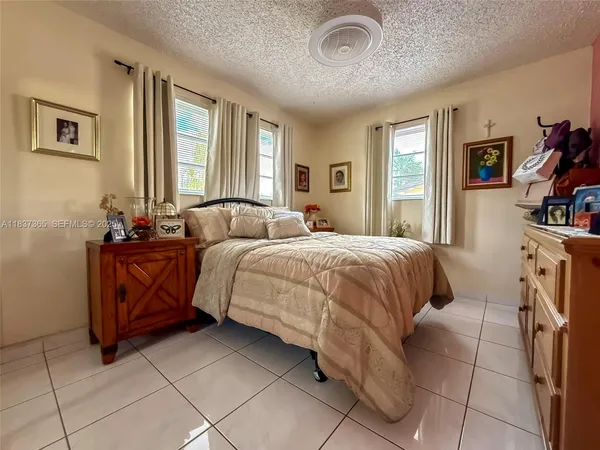 a bedroom with a bed and a cabinets