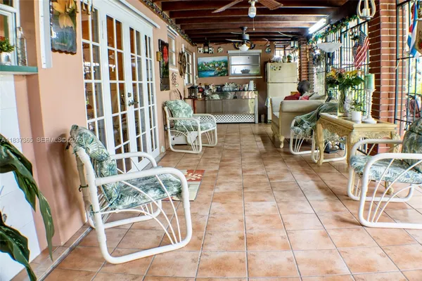 a view of a chairs and table in a patio