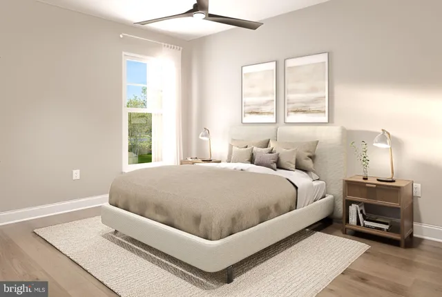 a spacious bedroom with a bed and a window