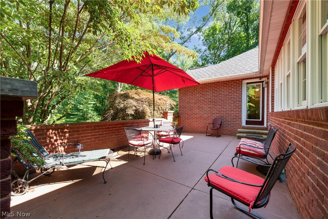 10400 Stoneacre Road Northwest Canal Fulton, OH 44614 - Photo 33 of 44 View of patio / terrace featuring outdoor dining area