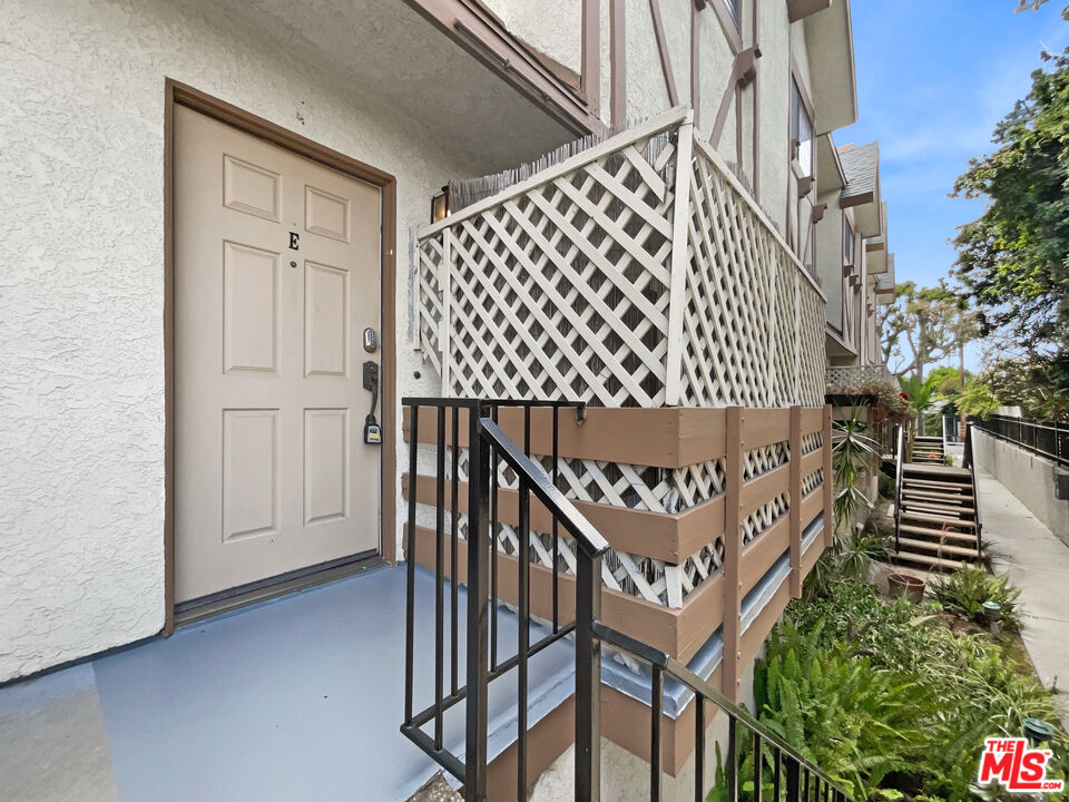 a view of entryway with wooden stairs