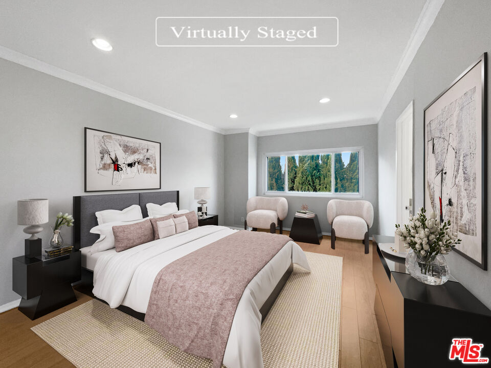 6864 Hatillo Avenue, Unit E Winnetka, CA 91306 - Photo 4 of 18 a bedroom with a large bed and a couch