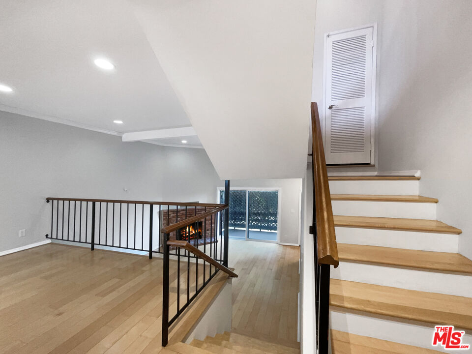 6864 Hatillo Avenue, Unit E Winnetka, CA 91306 - Photo 7 of 18 a view of entryway and hall with wooden floor
