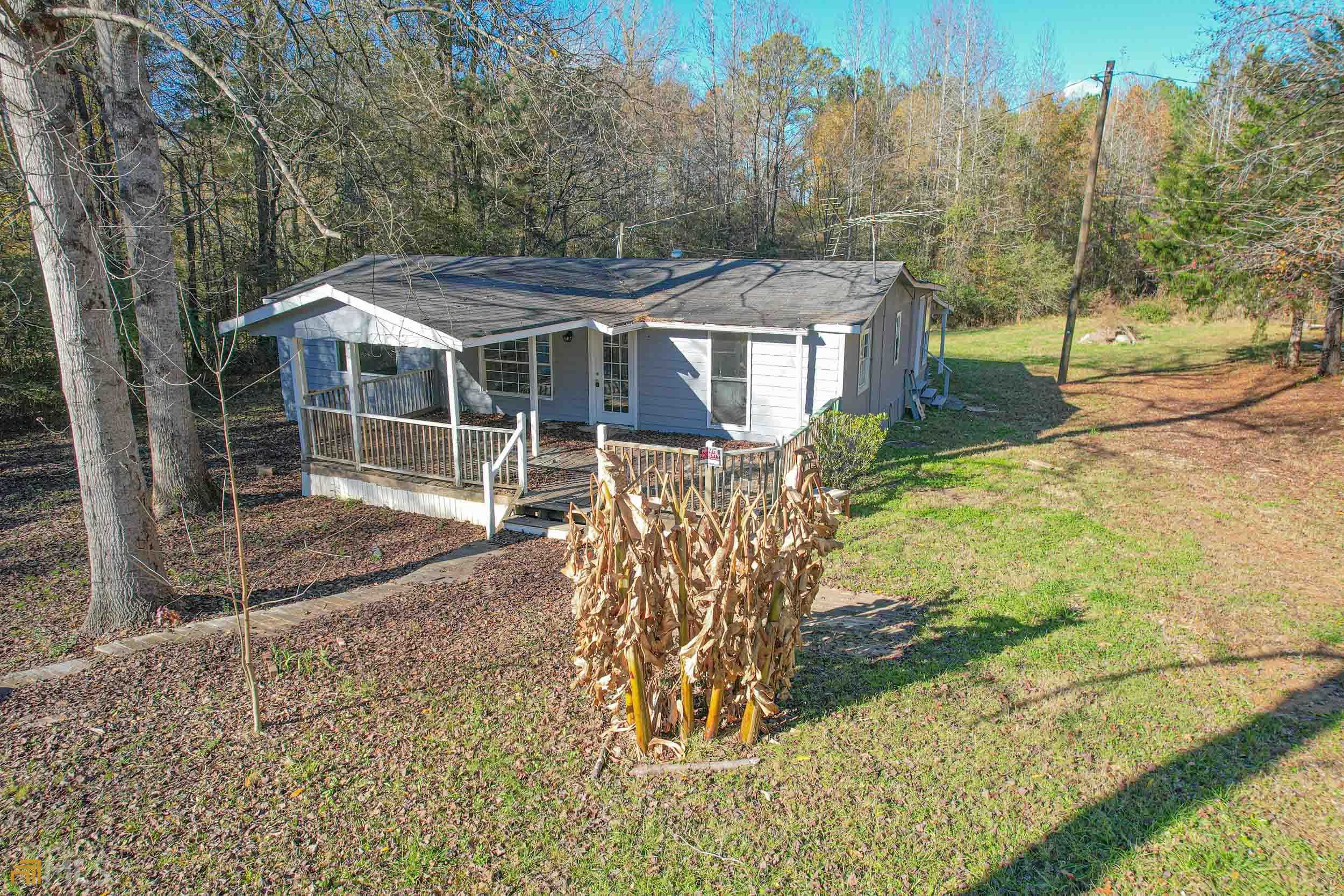 296 Rivers Road Williamson, GA 30292 - Photo 1 of 1 a view of a house with backyard and a tree