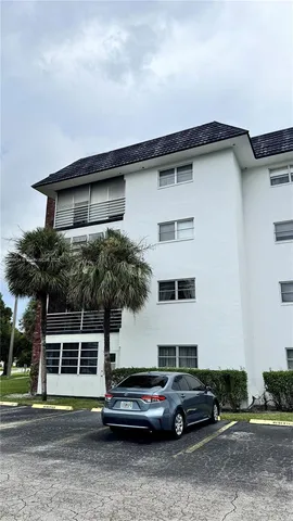 a front view of a house with parking