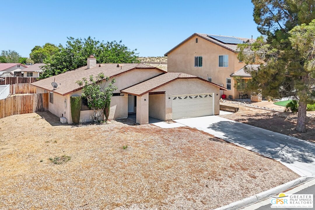 13819 Rivers Edge Road Helendale, CA 92342 - Photo 3 of 31 a front view of a house with a yard