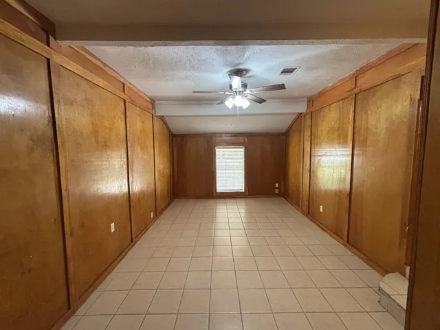 a view of an empty room with a bathroom