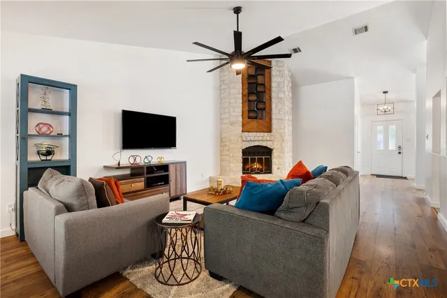 a living room with furniture and a flat screen tv