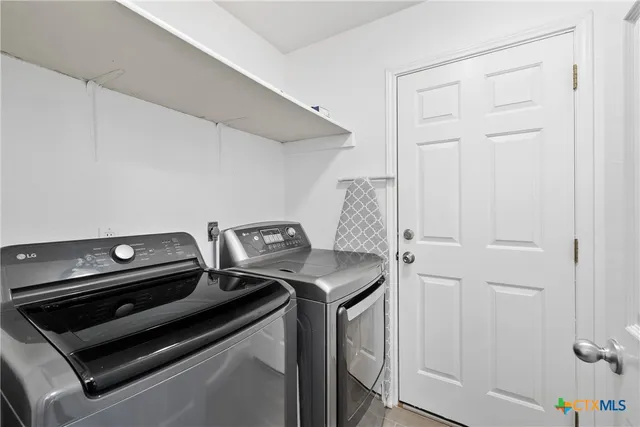 a stove top oven sitting inside of a kitchen