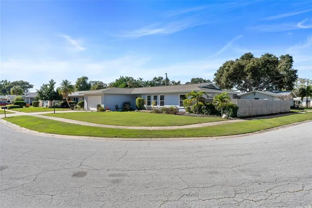 an aerial view of a house with a swimming pool