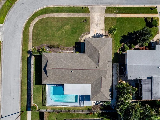 an aerial view of houses with outdoor space
