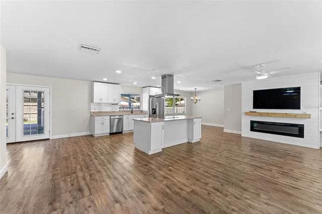 a view of kitchen with wooden floor