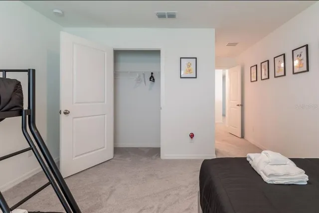 a view of bedroom with furniture and window