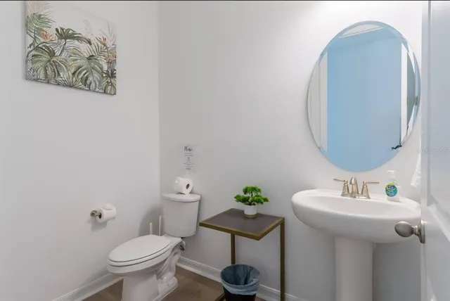 a bathroom with a toilet and a sink