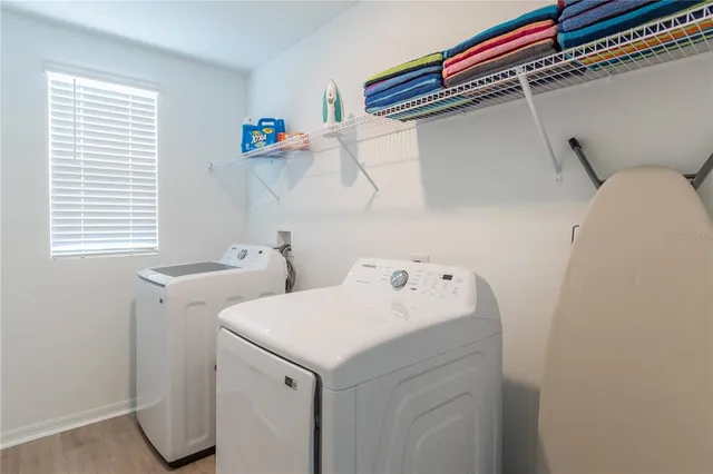 a utility room with dryer and washer