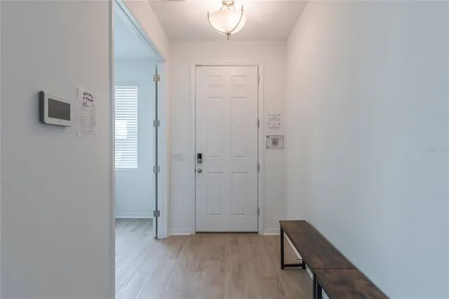 a view of a livingroom with wooden floor and closet