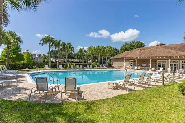 a view of a swimming pool with a patio
