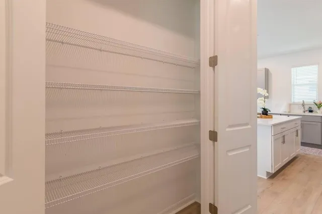 a bathroom with a shower and a sink