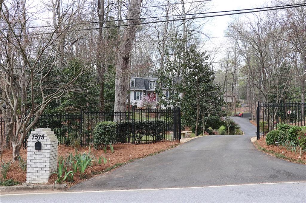 a view of a street with a building in the background