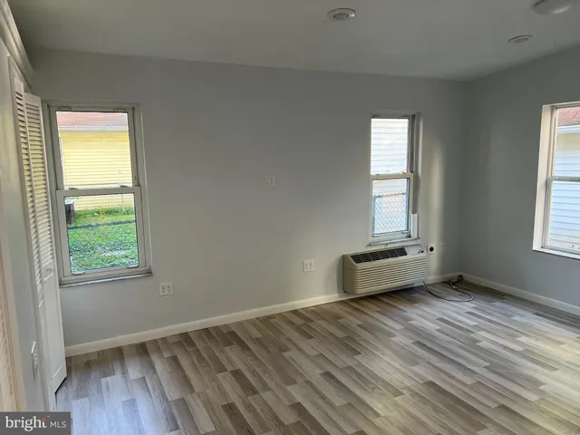 a white toilet sitting next to a shower