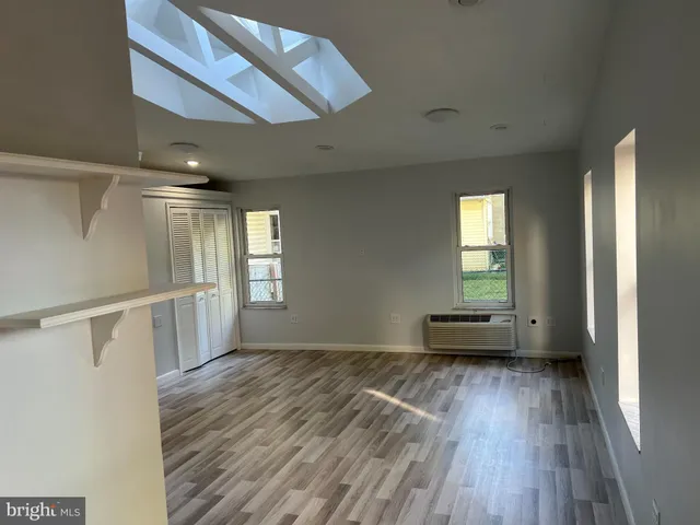 a view of a bathroom from a hallway