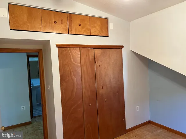 a kitchen with a refrigerator and a stove