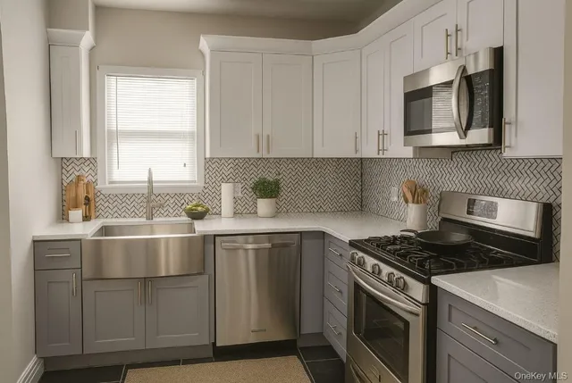 a kitchen with cabinets appliances a sink and a window