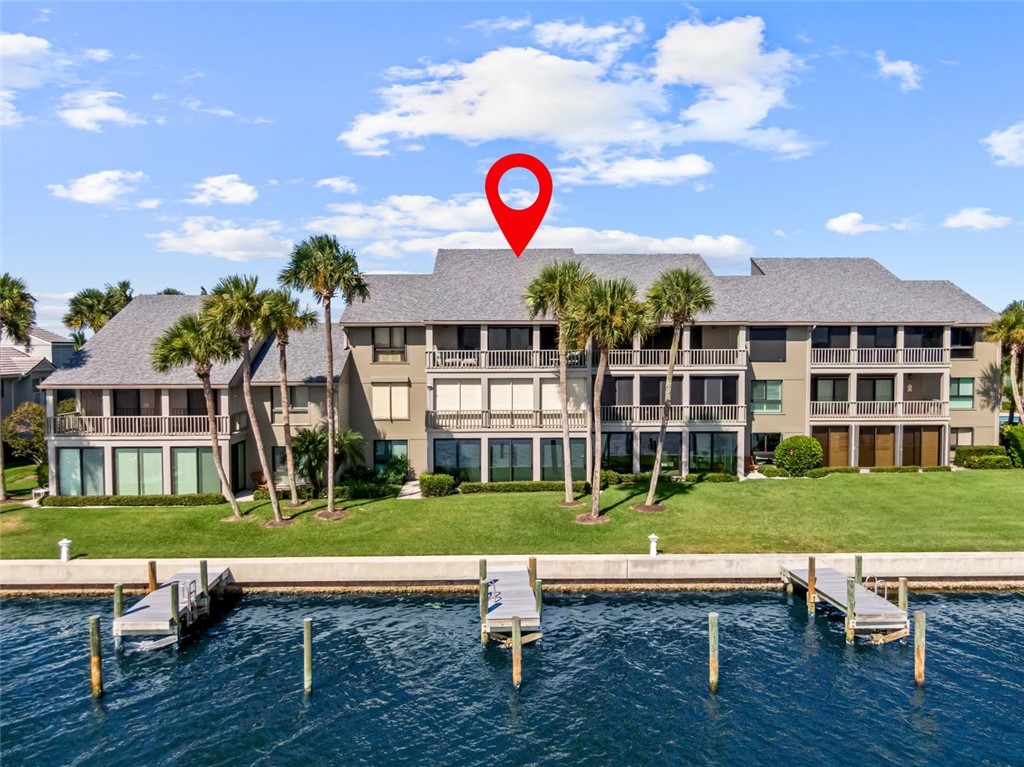 1001 Bay Road, Unit 302 Vero Beach, FL 32963 - Photo 1 of 31 a view of a house with a yard
