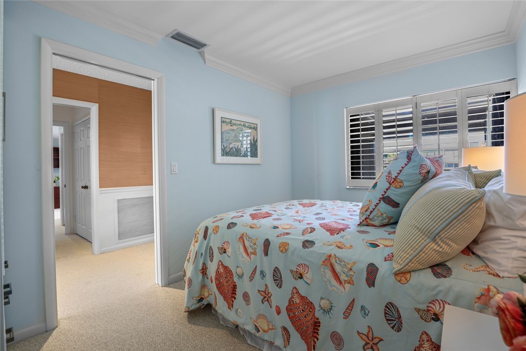 1001 Bay Road, Unit 302 Vero Beach, FL 32963 - Photo 19 of 31 a bedroom with a bed and a window