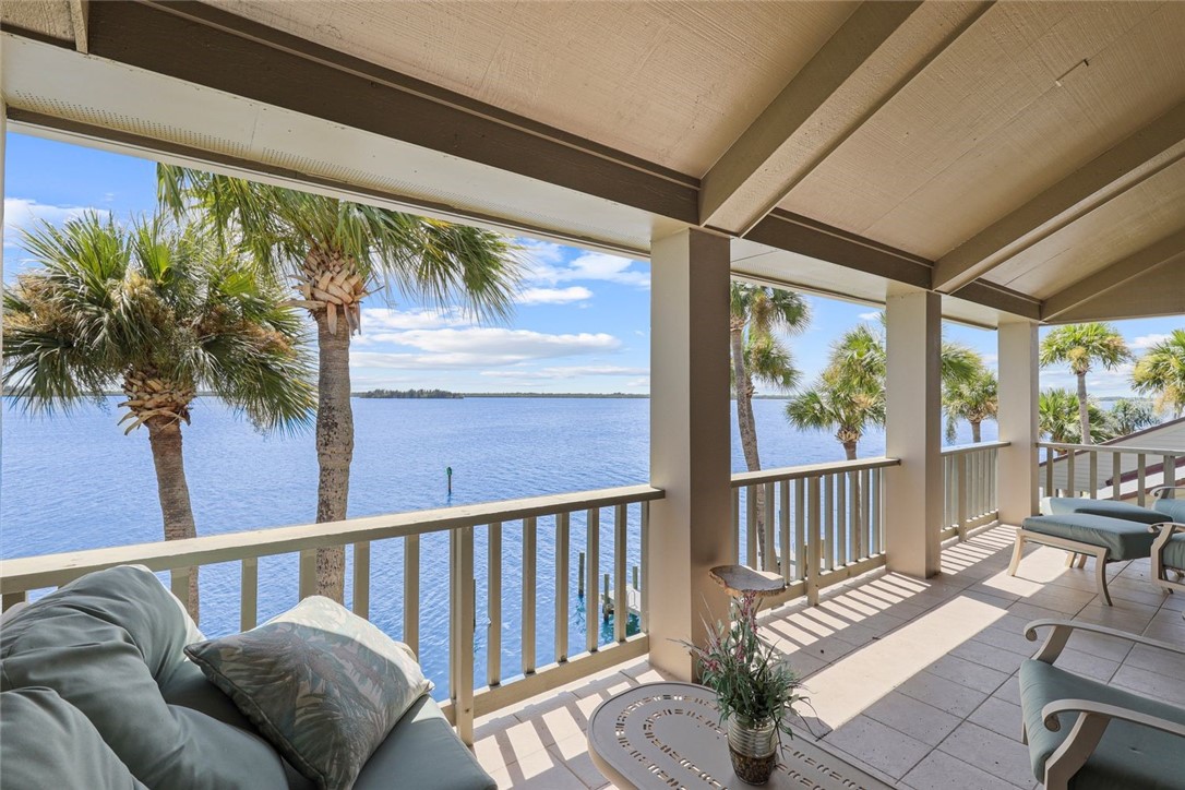 1001 Bay Road, Unit 302 Vero Beach, FL 32963 - Photo 21 of 31 a view of a porch with furniture and wooden deck