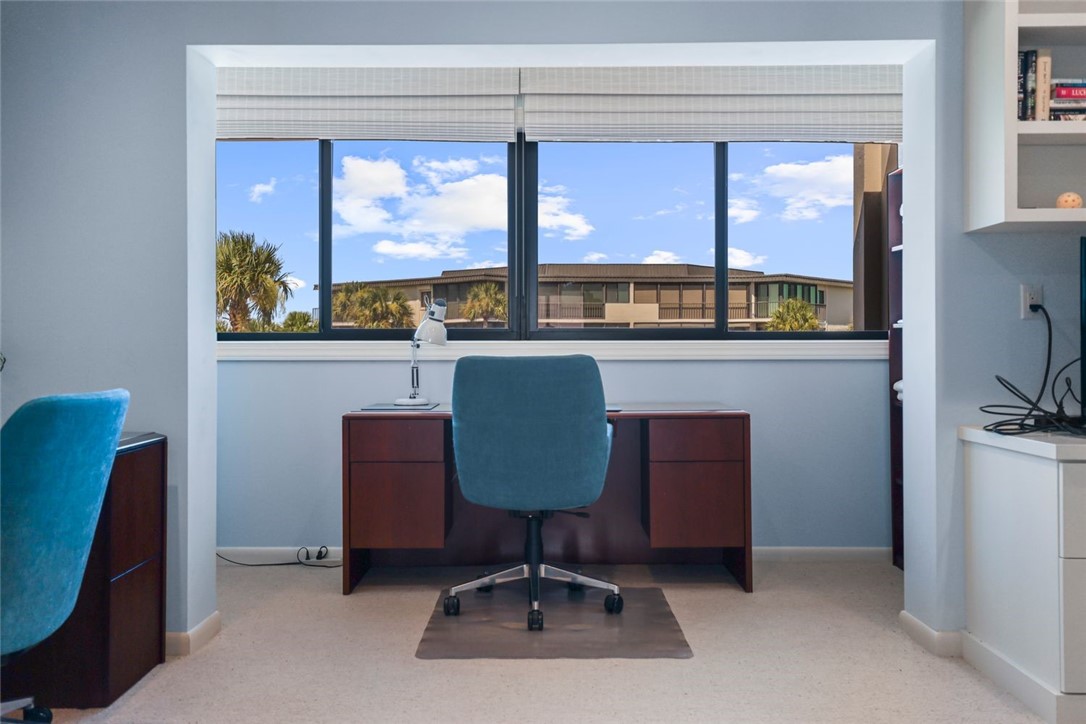 1001 Bay Road, Unit 302 Vero Beach, FL 32963 - Photo 23 of 31 a living room with furniture and a window