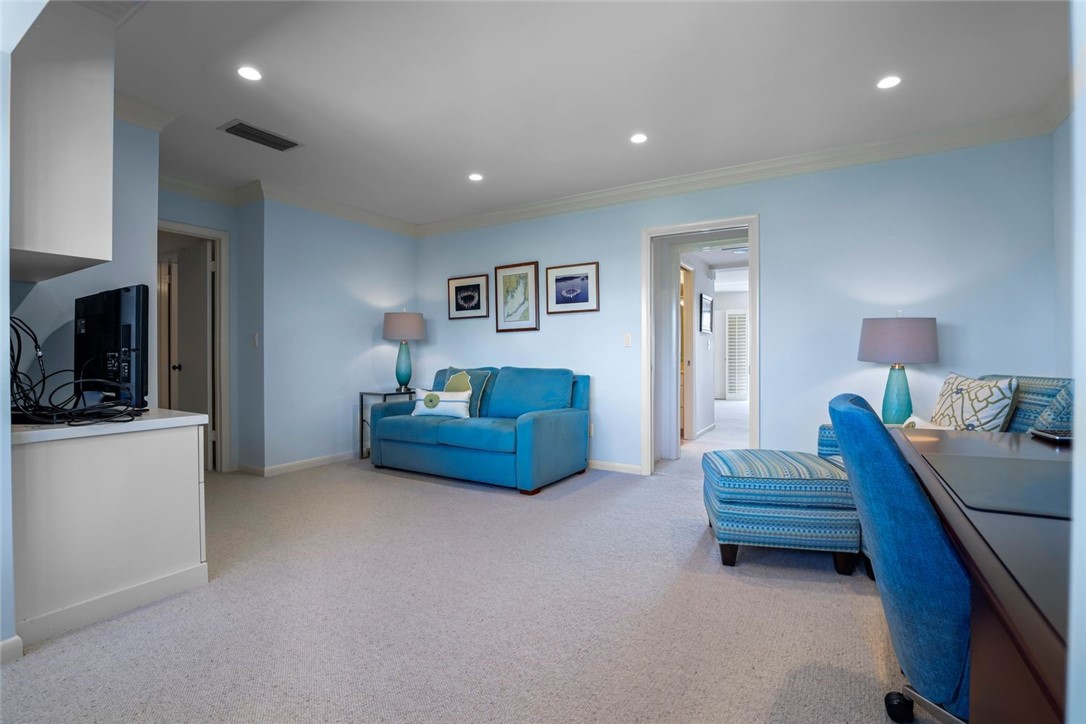 1001 Bay Road, Unit 302 Vero Beach, FL 32963 - Photo 26 of 31 a living room with furniture and a flat screen tv