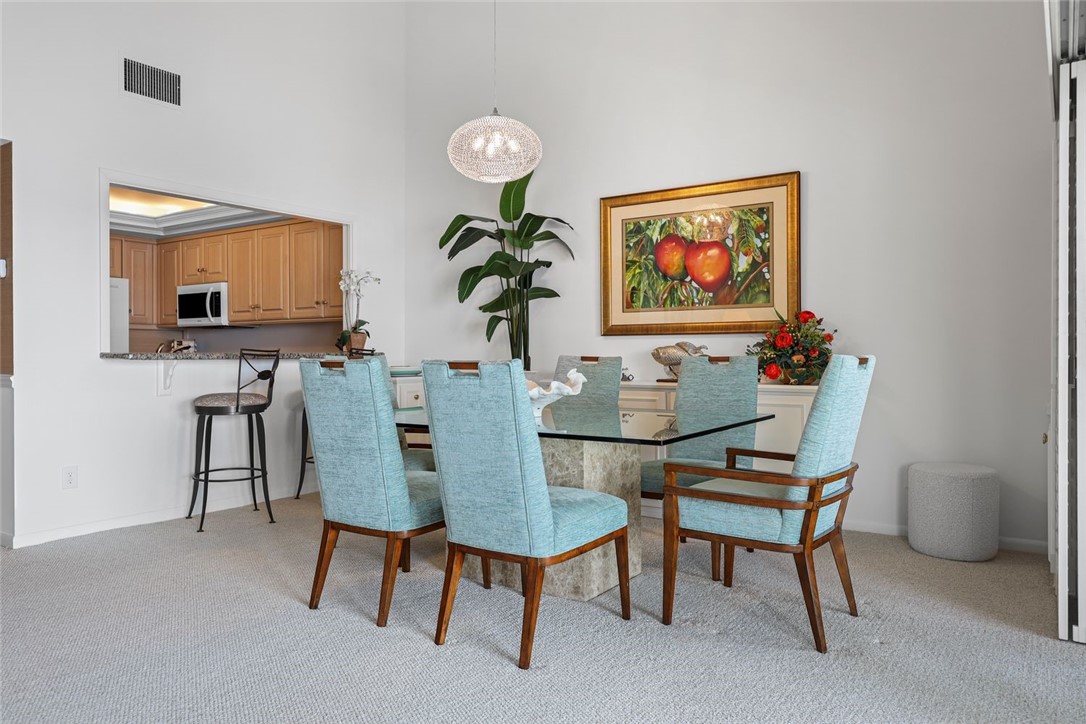1001 Bay Road, Unit 302 Vero Beach, FL 32963 - Photo 7 of 31 a view of a dining room with furniture