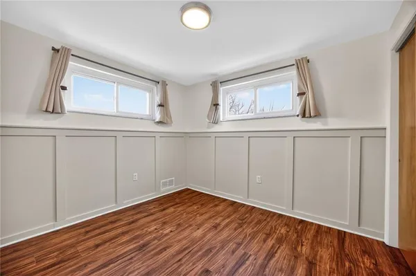 a view of a livingroom with wooden floor