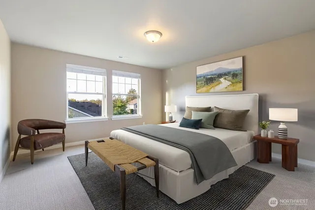 a bedroom with a bed and a chair