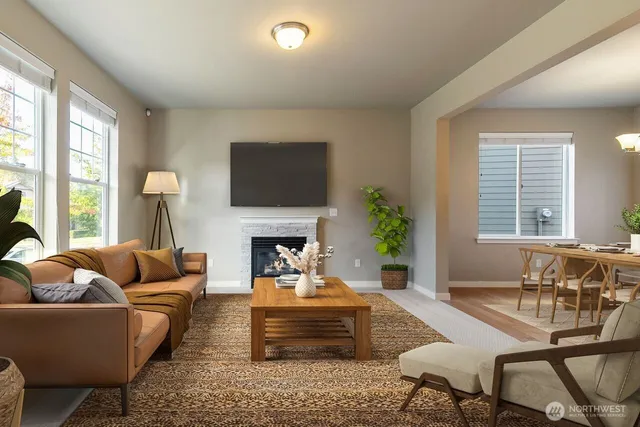 a living room with furniture fireplace and a flat screen tv