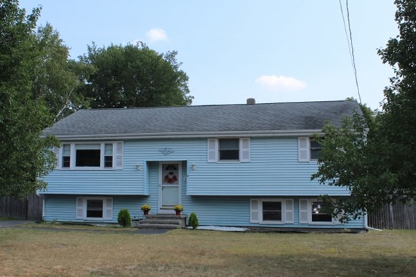 3 Palmer Road Pepperell, MA 01463 - Photo 1 of 17 a front view of a house with a yard