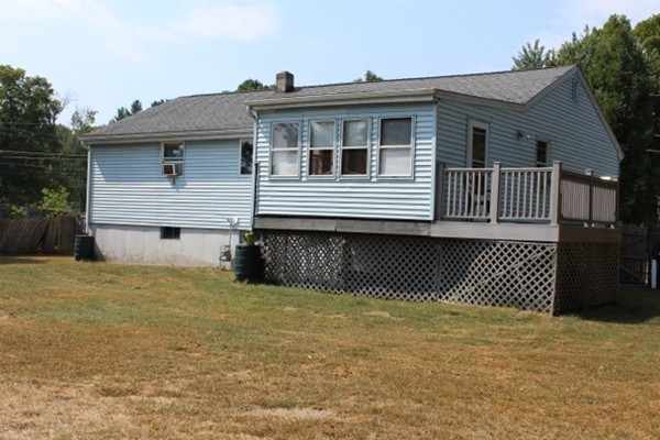 3 Palmer Road Pepperell, MA 01463 - Photo 14 of 17 a view of a house with a wooden deck