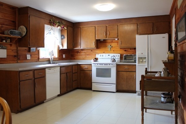 3 Palmer Road Pepperell, MA 01463 - Photo 2 of 17 a kitchen with a sink a stove a refrigerator and cabinets