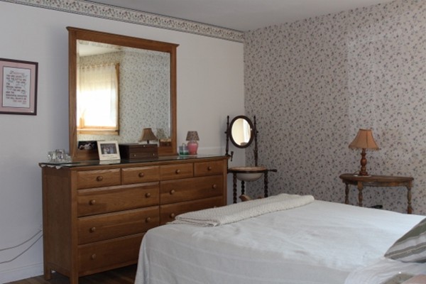 3 Palmer Road Pepperell, MA 01463 - Photo 5 of 17 a bedroom with a bed and wooden floor