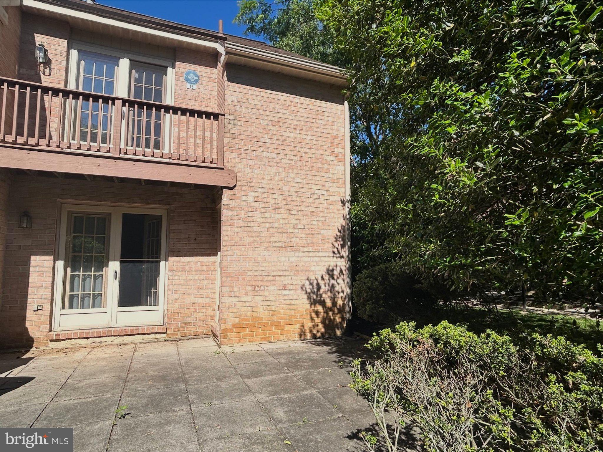 15 Rampart Drive Wayne, PA 19087 - Photo 6 of 11 Charming brick home with lush greenery.