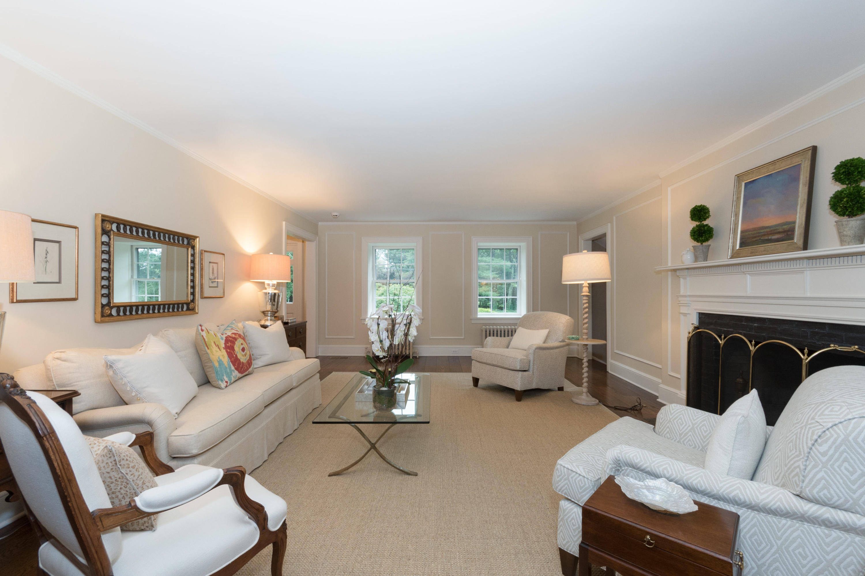 9 Pembroke Road Darien, CT 06820 - Photo 8 of 40 a living room with furniture and a fireplace
