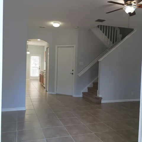 a view interior of a house with stairs and a hallway