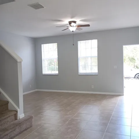 a view of an empty room with a window