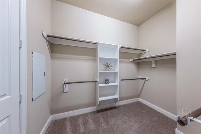 a view of an empty walk in closet