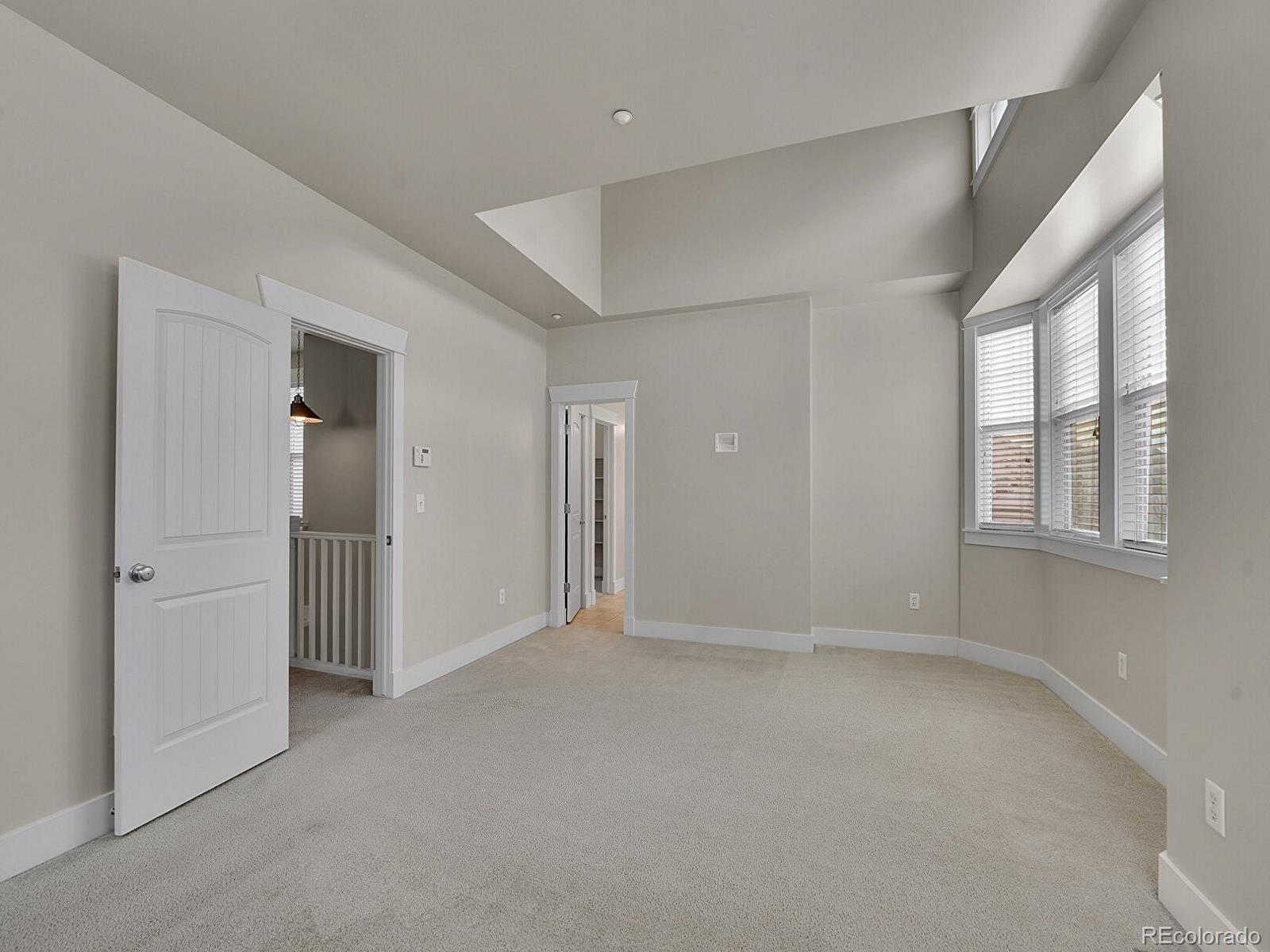 11718 Perry Street Westminster, CO 80031 - Photo 6 of 15 wooden floor and windows in a room