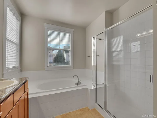 a white bath tub sitting next to a window