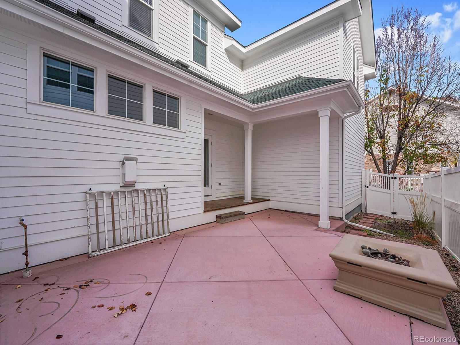 11718 Perry Street Westminster, CO 80031 - Photo 8 of 15 a view of backyard with barbeque grill and stairs