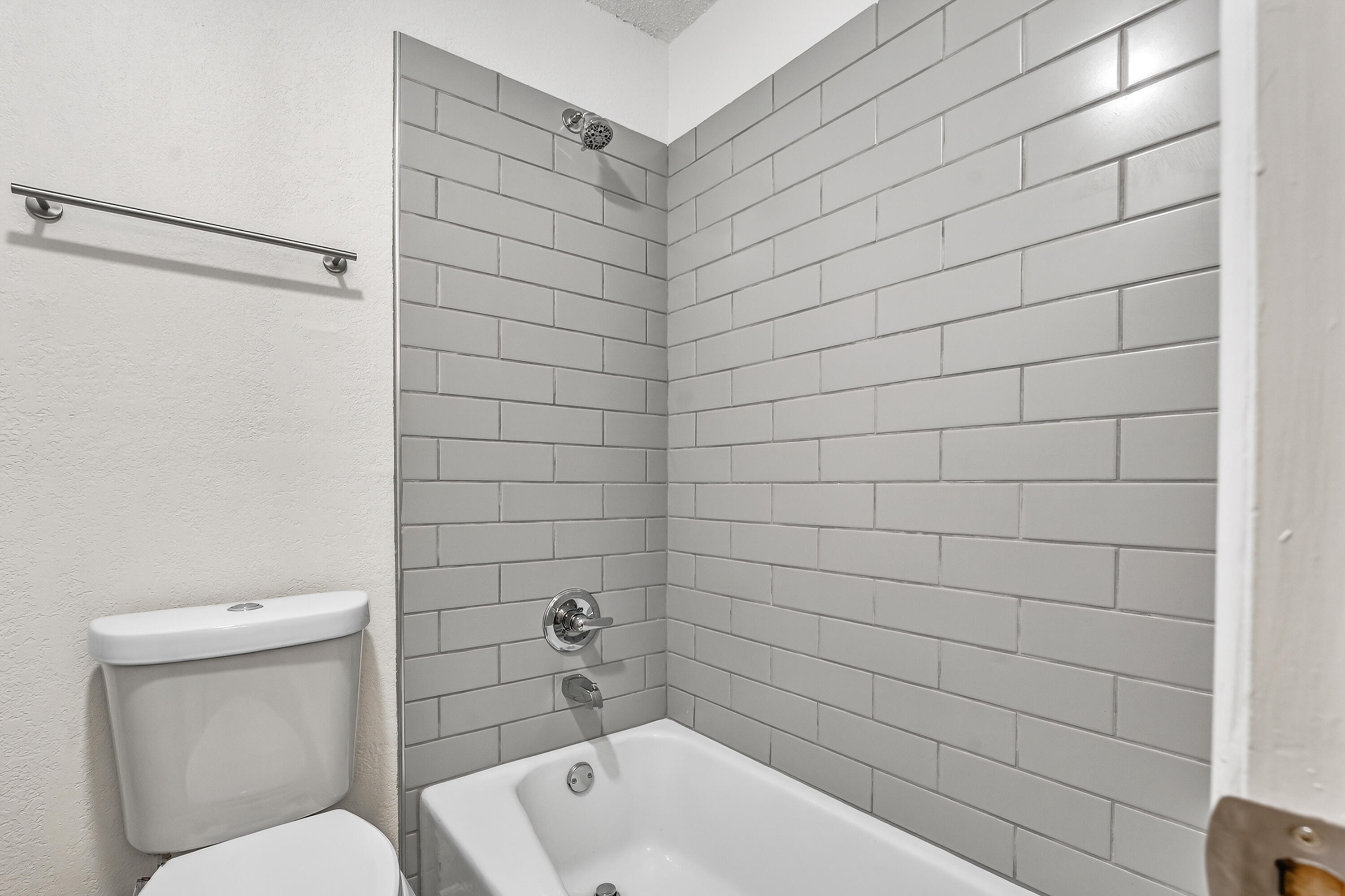 5751 38th Street Lubbock, TX 79407 - Photo 18 of 22 a bathroom with a toilet and shower