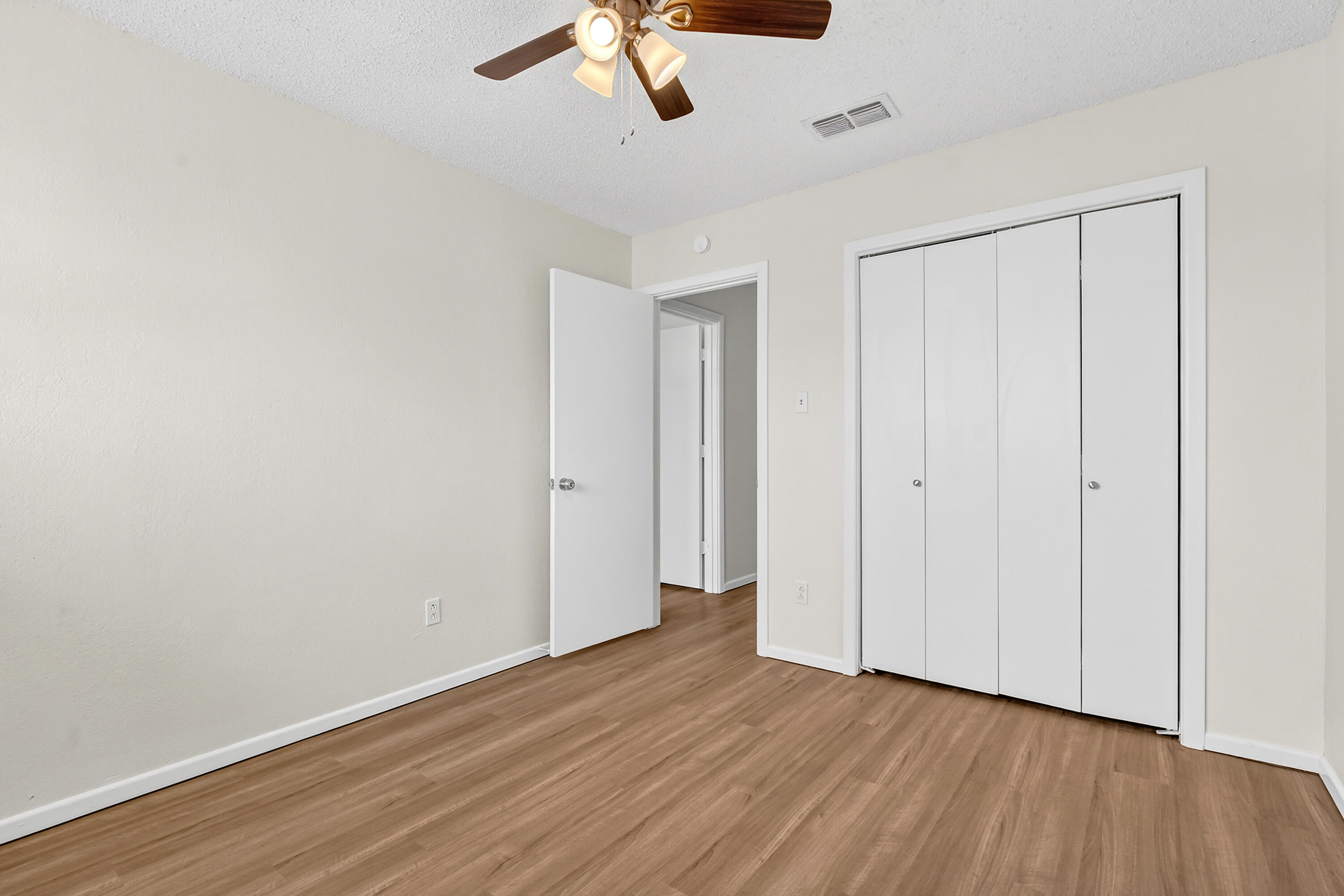 5751 38th Street Lubbock, TX 79407 - Photo 20 of 22 a view of an empty room with wooden floor